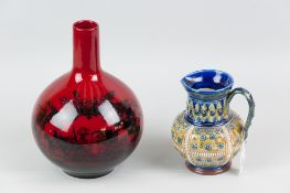 A Royal Doulton flambe woodcut bottle vase with transfer decorated coach and horses scene, factory