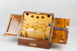 An excellent Victorian burr walnut stationery box, the twin slope-fronted doors opening to reveal