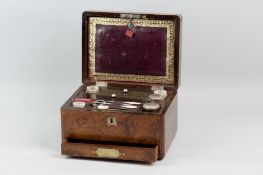 A Victorian lady's rosewood travelling case with inset brass carrying and drawer handles, the lid