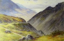 WARREN WILLIAMS watercolour - mountain roadway with view of the sea in background, entitled '