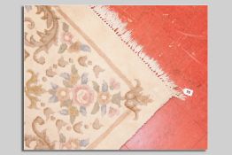 A cream ground washed Chinese carpet with floral decoration, approximately 4 x 3 yds