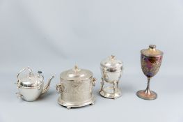 An oval electroplate lidded biscuit barrel, an electroplated egg warmer, an electroplated lidded