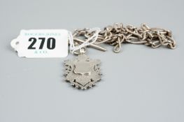 A silver Albert with T-bar, swivel and silver trophy pendant, 1.3 ozs