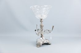 A Walker & Hall electroplated centrepiece epergne having a shaped scrolled and shell base with a