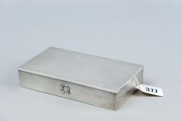 An oblong engine turned silver bound cigarette box, Birmingham 1957