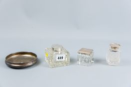 Three square glass single ink bottles each with silver tops, Birmingham 1921, London 1909 and