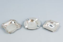 A parcel of three silver ashtrays being two square engine turned and one plain silver, total 4 ozs