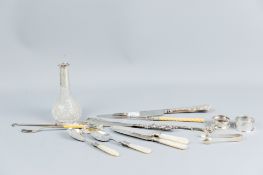 A parcel of silver/silver handled cutlery and manicure pieces, two silver napkin rings, a pair of