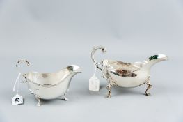 A silver cream boat on three shell and hoof supports, 3.7 ozs, Sheffield 1945 and a Britannia silver
