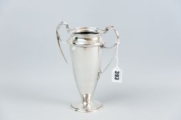 A plain silver twin handled vase of tapered form with a circular base, 7.25 ins (19 cms) high, 11