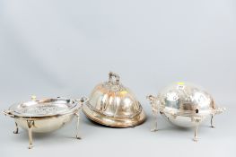 Two cylinder top twin handled entree dishes, one on four claw supports and the other on pad supports