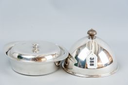 A three piece all silver muffin dish of circular form and having an interior lid with dome topped
