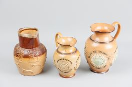 A Doulton Lambeth stoneware jug decorated with incised and relief roundels with surrounding