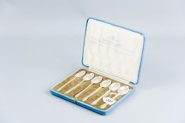 A cased set of 'British Hallmarks Spoons', these being six coffee spoons, 2.6 ozs, Glasgow 1935