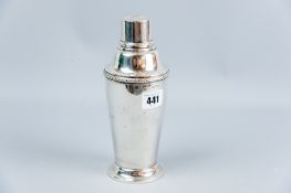 A circular based silver cocktail shaker of plain slightly tapered form with stepped lid, 11.4 ozs,