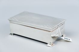An oblong plain silver cigarette box with engine turned lid, Birmingham 1939