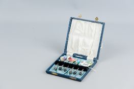 A cased set of six bead handled coffee spoons with round bowls and each spoon having a non-silver