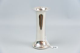 A plain silver trumpet vase having a wide rim and wide base, 8 ins (20 cms) high, 13.3 grms gross (