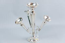 A circular based silver epergne having a fixed centre trumpet of tapered and panelled form and