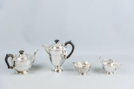 A four piece silver tea and coffee service, each piece of circular plain panelled form and the