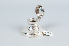 A plain circular silver inkwell with hinged lid, Chester 1916