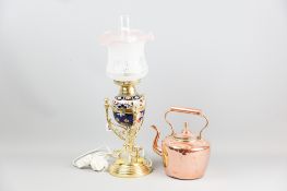 A Doulton pottery and brass paraffin lamp (later converted to electricity) with glass funnel and