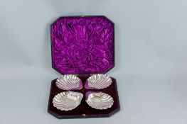 A cased set of four electroplated scallop shell butter dishes