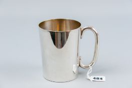 A plain silver mug, 13 ozs, Birmingham 1932