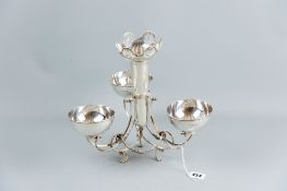 A silver centrepiece, the base of garlanded and scrolled form and three claw supports having a