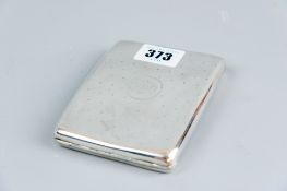 A silver cigarette case of curved form, 4.5 ozs, Birmingham 1915