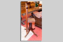 A Victorian mahogany near square topped tea table having a centre turned ring column to four splayed