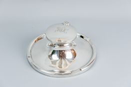 An impressive large circular silver single bottle inkstand with hinged lid, 8 ins (20 cms) diam (