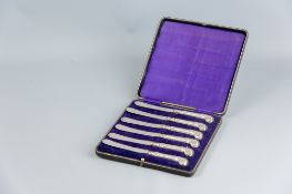A cased set of six silver pistol handled plated cake knives, Sheffield 1894
