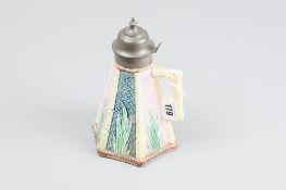 A Majolica pottery syrup jug of conical form, bamboo and wickerwork panels with leaf highlights,