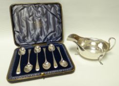 A set of six silver tea-spoons with chase decoration to the handles; together with a silver sauce-