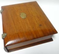A nineteenth century mahogany writing box with brass cartouche and hinges, 10ins wide (25cms)