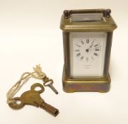 A miniature brass Swiss movement carriage clock with white enamel dial bearing Roman numerals, 3.