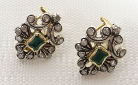 A pair of early twentieth century emerald and diamond abstract earrings