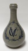 An interesting eighteenth century stoneware bottle-vase, the body bearing the cypher 'VOC' to