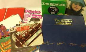 A large collection of periodicals, books, single and LP vinyl relating to The Beatles