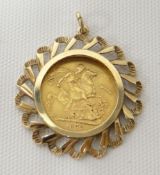 A gold full sovereign, 1872 together with a fancy 9ct pendant mount, 5.23gms