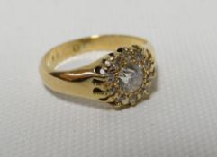 A diamond floral ring with centre stone of 0.4ct (visual estimate) surrounded by a circle of ten