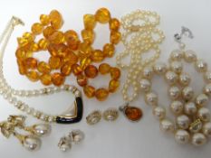 A parcel of pearls including cased Mikimoto and amber style beads etc