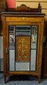 A marquetry and ebonised rosewood music cabinet with semi-glazed single panelled door, with shaped