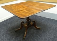 A fold over inlaid mahogany tea-table on four curved and scrolled supports (faded), 36ins wide (