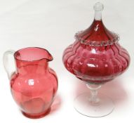 A good cranberry glass covered bowl with clear glass stem, foot and finial, 13ins high (33cms);