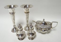 A silver mustard pot, a pair of silver rose-vases and a pair of silver pepperettes