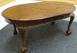 A wind-out mahogany oval dining table, circa 1900, extending to 69.5ins (177cms)