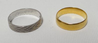 A textured platinum band ring, 4.74gms; together with a 22ct gold plain wedding-band, 4.5gms