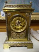 A mid-nineteenth century gilt-metal French movement mantel clock with Vincent, Paris medallion,